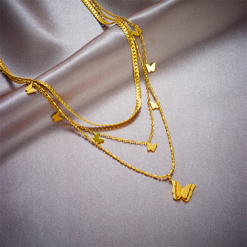 SWIRLUXE GOLD BUTTERFLY NECKLACE